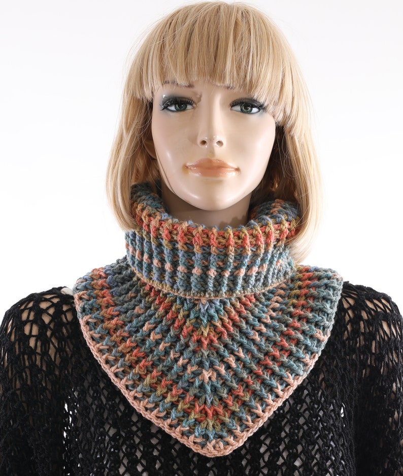 May include: A crocheted cowl with a triangular shape and a ribbed texture. The cowl is made with a multi-colored yarn in shades of blue, green, orange, and pink.