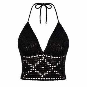 May include: A black halter top with a V-neck design. The top is made of crocheted material, featuring a detailed openwork pattern across the midsection. The halter straps tie at the back of the neck.