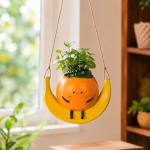 Cute Orange Character Hanging Planter On Banana Swing,Unique Indoor Window Plant Holder,Outdoor Yard Art,Housewarming Gift For Plant Lovers