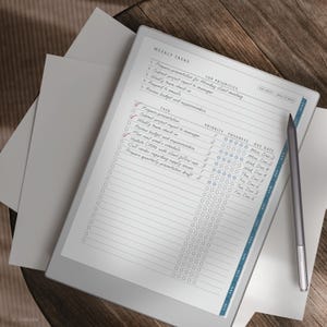 May include: A digital tablet displaying a weekly task list with a stylus. The screen shows a to-do list with priorities, progress indicators, and due dates. The tablet is on a wooden surface with a few sheets of paper.
