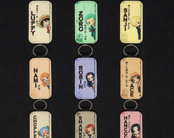 Chibi Anime One Piece Leather Keychain | Double-Sided Pirate Crew Keyring | 1.5” x 2.95” Faux Leather Bag Charm | Gift for Anime Fans