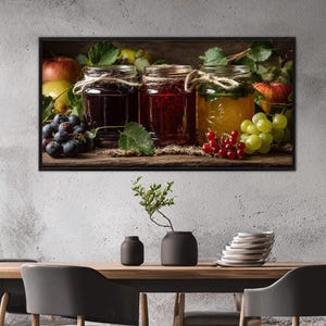 Quadro em tela com três potes de vidro contendo geleias de frutas, pronto para pendurar.