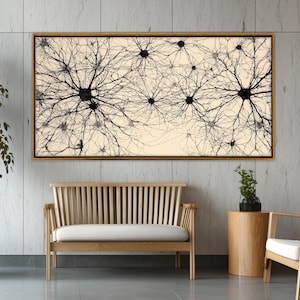 May include: A framed artwork featuring a black and white abstract neural network design. The artwork is displayed above a wooden bench with a white cushion. The room also includes a small wooden side table and two chairs.