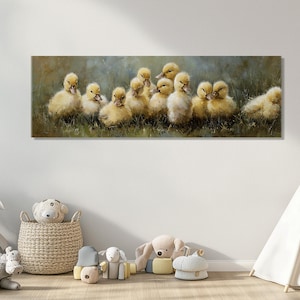 May include: A rectangular canvas print featuring a group of fluffy yellow ducklings. The ducklings are clustered together in a grassy area, with a soft, blurred background of green and brown tones. The artwork evokes a sense of warmth and nature.