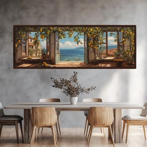 May include: A framed artwork depicts a scenic view through open windows, showcasing a coastal landscape. The windows are adorned with lemon trees bearing yellow fruit. The artwork is displayed above a wooden dining table with chairs.