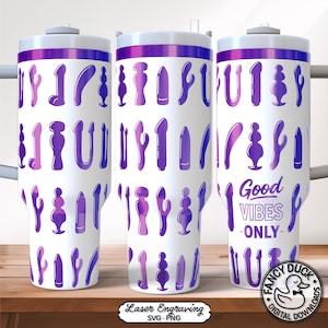 May include: White tumbler with a purple and blue pattern of sex toys. The tumbler has a purple rim and a white lid. The text "Good Vibes Only" is printed on the side. The tumbler is on a wooden surface.