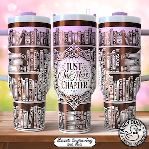 May include: A stainless steel travel mug with a brown and white design featuring bookshelves and the text "JUST One More CHAPTER". The mug has a white lid and a straw. The design is repeated around the mug.