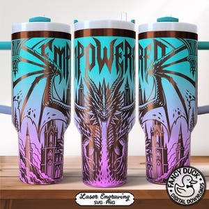 May include: A stainless steel tumbler with a dragon and castle design. The tumbler features a gradient of colors, including teal, purple, and brown. The words "EMPOWERED" are displayed on the tumbler.