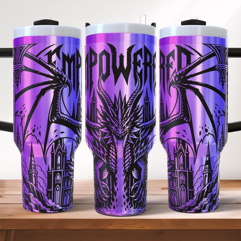 May include: Three purple insulated tumblers with a dragon and castle design. The word "EMPOWERED" is printed on the tumblers. The tumblers have a white lid and a black handle.