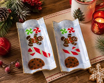 Pair of hand-painted ceramic Christmas dishes, gingerbread man, candy cane, signed Luigia Graceffa 2012