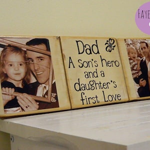 May include: A wooden sign with three photo frames and the text "Dad, A Son's hero and a daughter's first love". The photos show a father with his children.