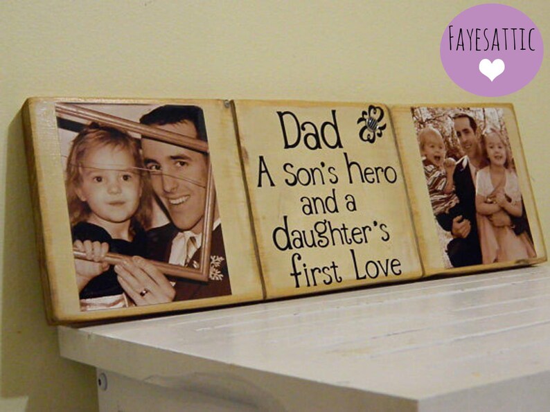 May include: A wooden sign with three photo frames and the text "Dad, A Son's hero and a daughter's first love". The photos show a father with his children.