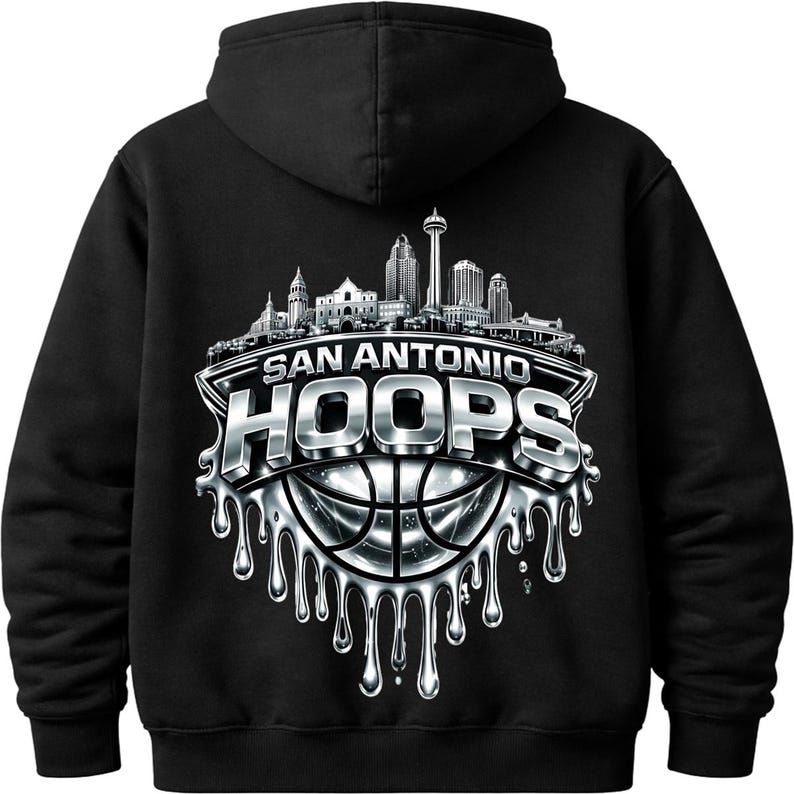May include: Black hooded sweatshirt featuring a silver and white graphic. The graphic includes the text "SAN ANTONIO HOOPS" above a basketball design with a cityscape silhouette. The design has a dripping effect.