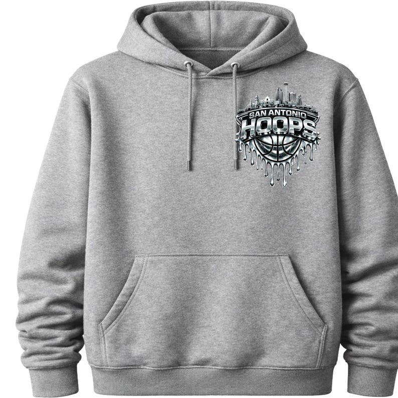 May include: A gray hoodie with a front pocket and drawstring hood. The front features a graphic of a basketball with the text "SAN ANTONIO HOOPS" and a cityscape design in silver and black.