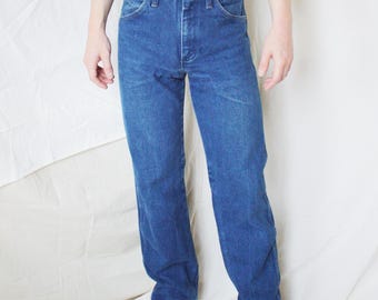 Calça jeans vintage masculina Wrangler, corte bota, cintura 28.