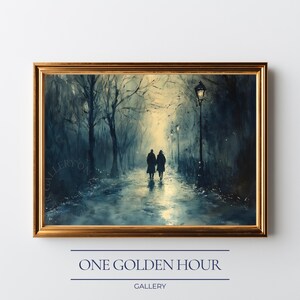May include: A framed art print depicts two figures walking down a path in a park at night. The painting is in shades of blue and gold, with streetlights illuminating the scene. The frame is gold, and the text "ONE GOLDEN HOUR GALLERY" is at the bottom.