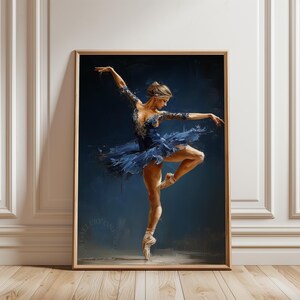 May include: A framed painting of a ballerina in a blue tutu, captured mid-dance. The artwork features a dark blue background, with the dancer's form highlighted in shades of blue and white. The ballerina is wearing pointe shoes.