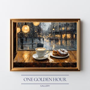 May include: A framed art print showing a cafe scene with a coffee cup and pastries on a wooden table. The painting depicts a rainy street scene outside the window, with streetlights and buildings. The text "ONE GOLDEN HOUR" and "GALLERY" are at the bottom.