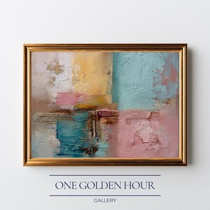 May include: Abstract oil painting in a gold frame. The artwork features textured brushstrokes in shades of yellow, teal, pink, and brown. The painting is framed with a gold border and includes the text "ONE GOLDEN HOUR GALLERY" at the bottom.