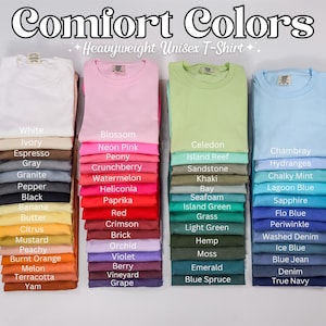 May include: A selection of Comfort Colors heavyweight unisex t-shirts in a variety of colours, including white, pink, green, and blue. The image showcases a wide spectrum of shades, from light pastels to deep, saturated tones, each colour labelled.