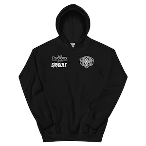 May include: Black hooded sweatshirt with white logos and text. The left chest displays "Paadox Cycles - S/R/CULT" and a bicycle logo. The right chest features a circular logo with "Rugby Racing Cycling Club".