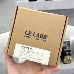 May include: A handmade wooden chopping board with a natural wood grain. The board is rectangular with a rounded handle and measures approximately 45 cm long and 30 cm wide.