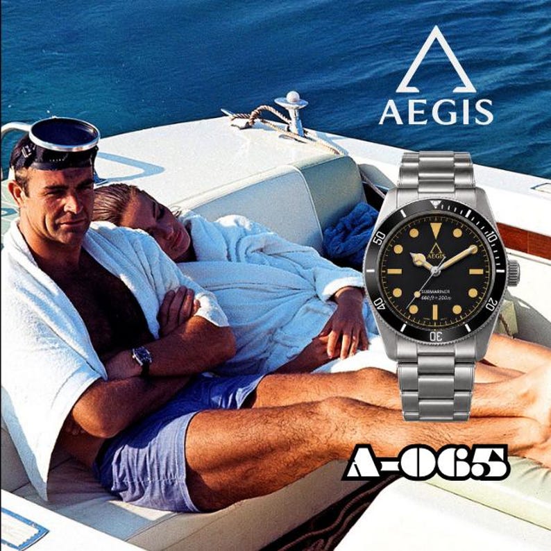 May include: A stainless steel wristwatch with a black dial, luminous hour markers, and a rotating bezel. The watch face features the Aegis logo, the text Submariner, and 660ft/200m. The model number A-065 is displayed below the watch.