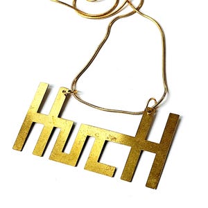 hs11 designer necklace, pendant "Oops... what's that?", brass, width 70 mm, height 35 mm, chain length 55 cm, absolutely unique!!!