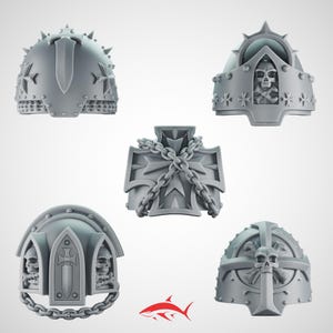May include: A selection of grey, 3D-printed miniature armour pieces. The designs include helmets and chest plates with crosses, skulls, and chain details. The pieces have a detailed, textured surface.