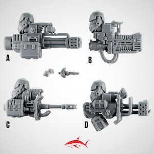 May include: Four grey plastic miniature weapon models, labelled A, B, C, and D, with additional small parts. Each weapon features a helmeted figure, intricate mechanical details, and a skull emblem. The weapons are designed for miniature gaming.