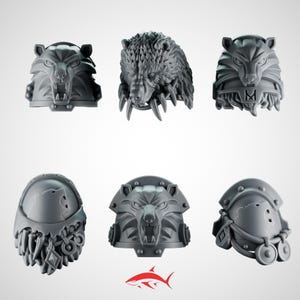 May include: A selection of grey, 3D-printed miniature bear and wolf heads, likely for tabletop gaming or model making. The heads display detailed textures and aggressive expressions, with visible teeth and fur. The image includes a shark logo.