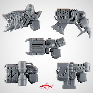 May include: Five gray plastic miniature weapon components with various designs, including a toothed jaw, the Roman numeral XVIII, and a double arrow symbol. The components are likely for a miniature war game.