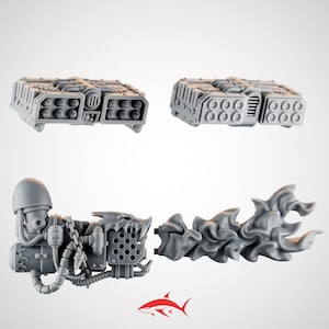 May include: Four grey plastic miniature war game components. Two rectangular missile launchers and two other pieces, one with a chain and the other with a flame effect. A red shark logo is in the bottom right corner.