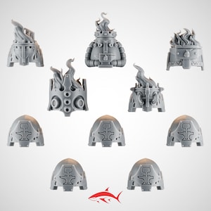 May include: A collection of gray miniature figurines, including ornate braziers with flame details and helmet-shaped pieces. The braziers have intricate designs and stylized flames. The helmet pieces feature a symbol.