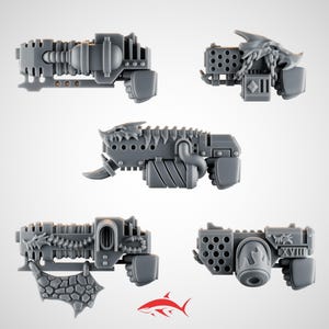 May include: A collection of five gray plastic miniature weapon models, each with intricate details and a futuristic design. The weapons feature various shapes, including barrels, grips, and decorative elements. The image includes a red shark logo.