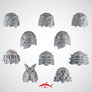 May include: A collection of gray, intricately designed miniature shoulder armor pieces. The set includes various styles, such as helmets and ornate, textured pauldrons. The pieces are likely for miniature wargaming or model building.