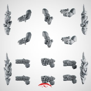 May include: A selection of grey plastic miniature weapon components, including arms with attached guns and flame-shaped decorative elements. The guns feature intricate designs, and the parts are likely for model building or tabletop gaming.