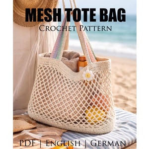 May include: A beige mesh tote bag with a crochet pattern, filled with items. The bag has rainbow-colored straps and a small flower embellishment. Text on the image reads "MESH TOTE BAG CROCHET PATTERN". The bag is on a beach.