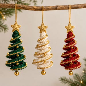 May include: Three hanging Christmas tree ornaments made of crocheted yarn in dark green, cream, and deep red. Each tree features a gold star at the top, a gold bead at the base, and a spiraling gold metallic thread accented with small gold beads.