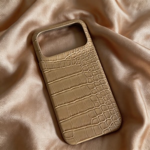 May include: A set of three ceramic mugs with a speckled, matte finish. The mugs are in shades of cream, light gray, and dark gray. Each mug has a simple, minimalist design, perfect for coffee or tea.