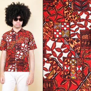 May include: A red, white, and black short-sleeved button-up shirt with a geometric and floral pattern.