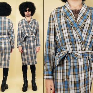 May include: A blue and white plaid robe with a yellow trim. The robe has a shawl collar and a tie belt.