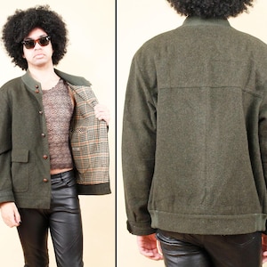 May include: A dark green wool jacket with a button-up front, two front pockets, and a plaid lining. The jacket has a bomber-style collar and cuffs. The jacket is shown from the front and back.