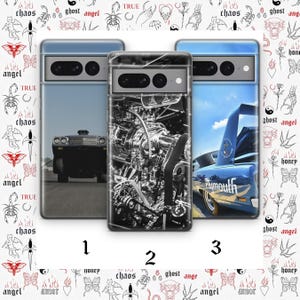 May include: Three phone cases with car-themed designs. One case features a black and white engine, another a blue car with a spoiler, and the third a classic car on a road. The cases are numbered 1, 2, and 3.