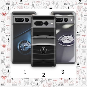 May include: Three phone cases with car emblem designs. The cases are black, gray, and blue. The background is white with tattoo-style illustrations. The numbers 1, 2, and 3 are printed below the cases.
