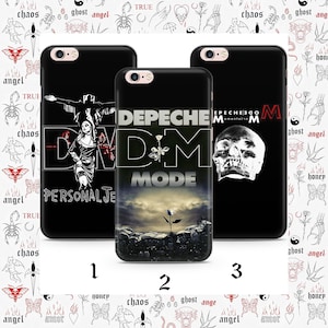 May include: Three black phone cases with Depeche Mode designs. One features a band image and the text "PERSONAL JE". Another displays the band's logo with a rose. The third case has a skull image. The background is white with tattoo-style illustrations.