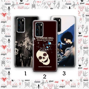 May include: Three phone cases with different designs. One features a group of people, another has a skull with the text "CYPRESS HILL INSANE IN THE BRAIN 1993", and the third has a person with a blue background. The cases are black with a Leica camera.