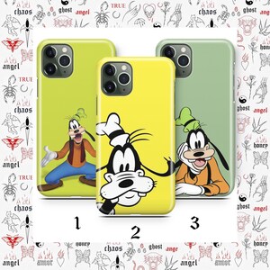 May include: Three phone cases with cartoon character Goofy designs. The cases are in shades of yellow and green. The background features a white pattern with various small illustrations and the numbers 1, 2, and 3.