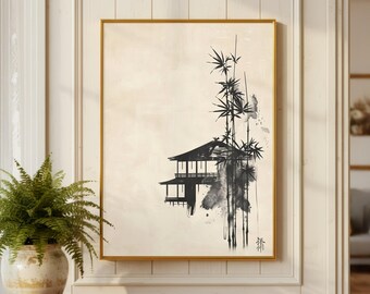 May include: A framed art print featuring a black and white ink wash painting of a traditional Japanese building and bamboo stalks. The artwork has a minimalist style with a gold frame and a cream-colored background. The print is displayed on a white wall.