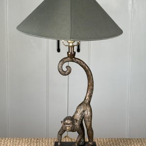 May include: A rustic wooden sign with the text "Welcome to our home" in white lettering. The sign features a distressed finish and a simple, inviting design, perfect for entryway decor.